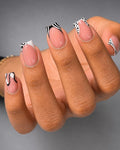 Pink butterfly french stiletto nails
