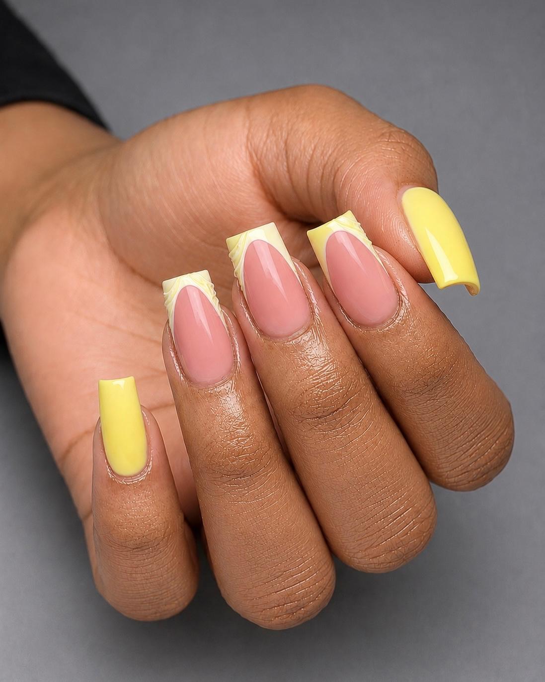 Yellow french tips on nude base mixed almond and square nails